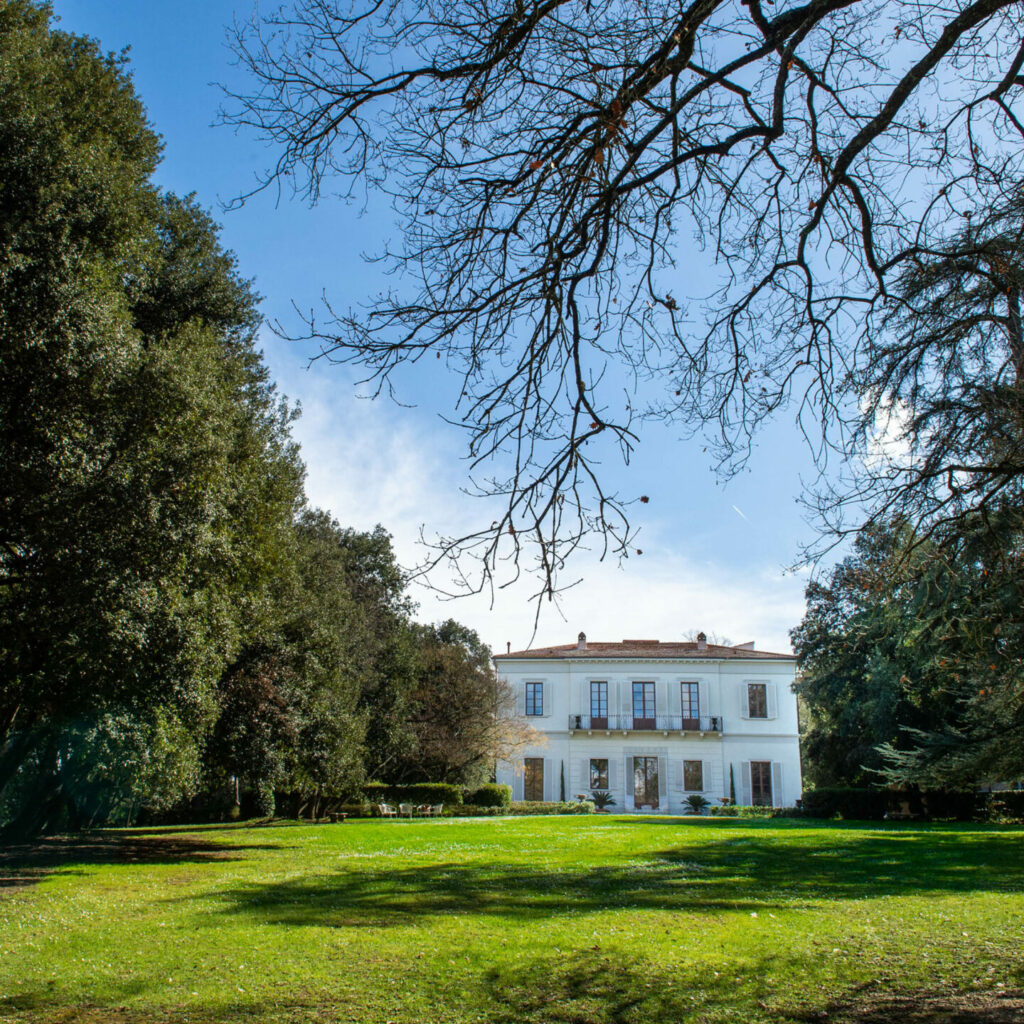 Historic villa of Cantina Villa Cosmiana surrounded by trees