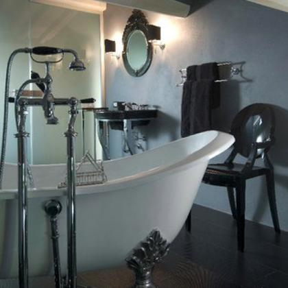 Elegant bathroom with freestanding tub and black furnishings